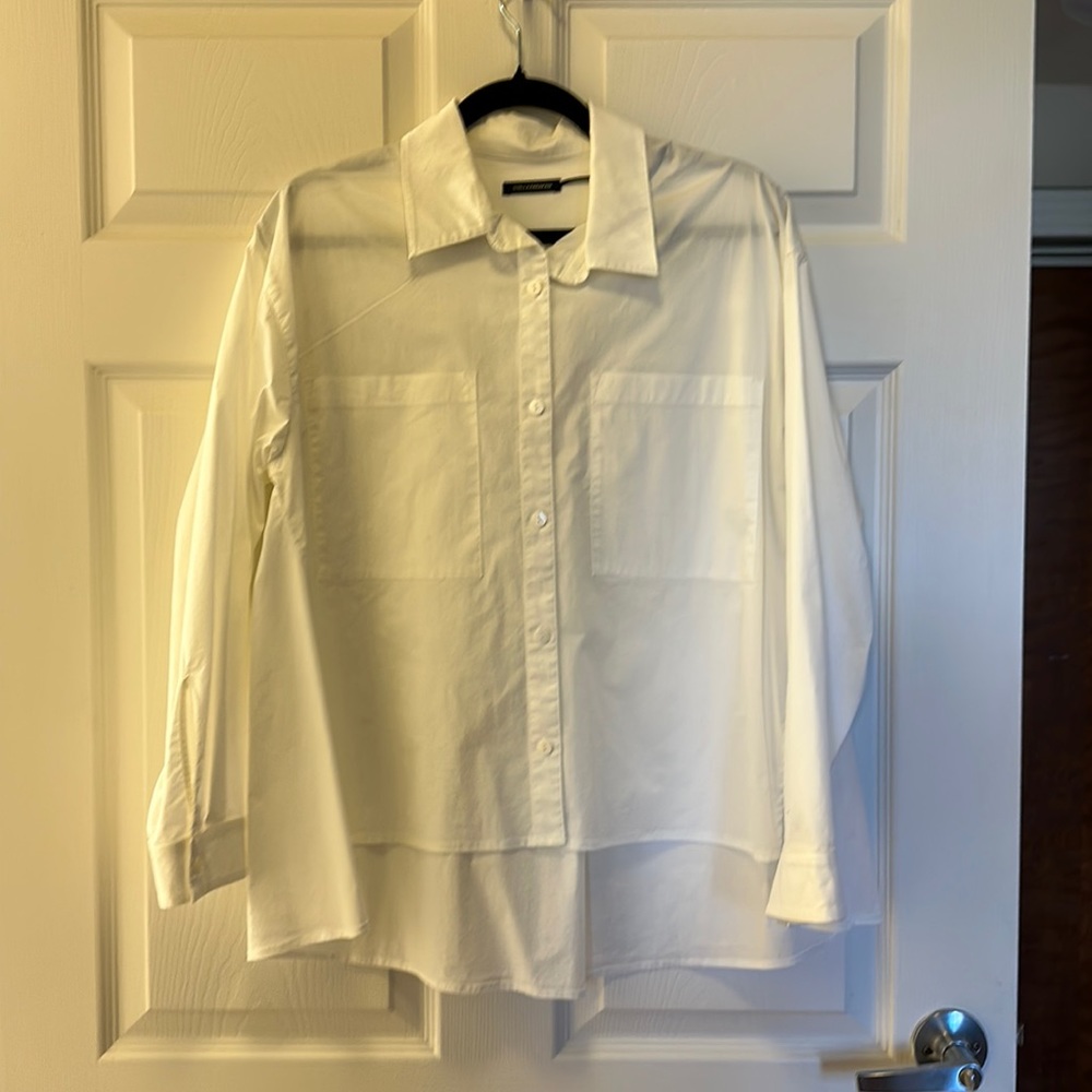 Stella Carakasi white button up blouse size medium large Hi-low hem